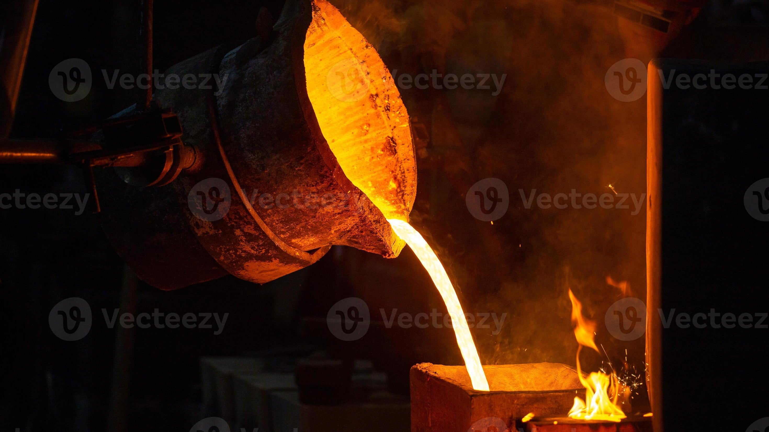 Molten bronze being poured into a sand mold at Neenah Bronze and Aluminum Foundry, Neenah Wisconsin
